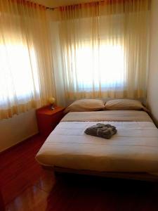 Tempat tidur dalam kamar di Apartment Svetlana 8