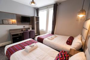 Säng eller sängar i ett rum på Euro Hotel