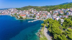 an aerial view of a town on the water at Kamis Suite in Neos Marmaras