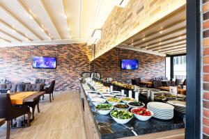 a buffet line with plates and bowls of food at Mari Suites Hotel in Istanbul