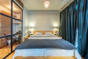 Ένα ή περισσότερα κρεβάτια σε δωμάτιο στο Design Apartment