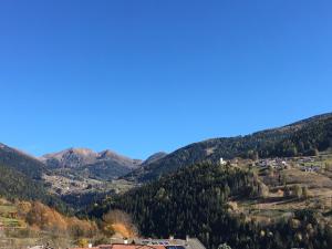 a view of a mountain with houses and trees at Santorsola Relax Hotel in Sant’Orsola