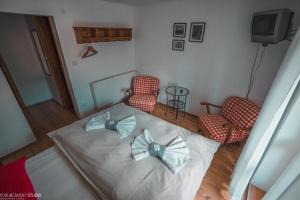 Ένα ή περισσότερα κρεβάτια σε δωμάτιο στο Penzion Muran