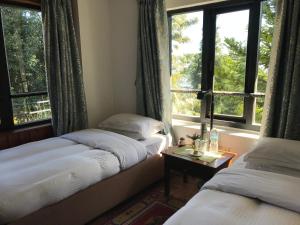 מיטה או מיטות בחדר ב-The Fort Resort