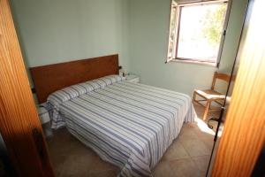Giường trong phòng chung tại Sa Curcurica