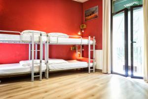 Posteľ alebo postele v izbe v ubytovaní Itaca Hostel