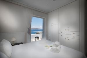 Postel nebo postele na pokoji v ubytování Sounio Villa + 37 fotografií