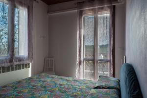 Pizzicalaluna Agriturismo Olistico sulle Colline di Pianoro客房内的一张或多张床位