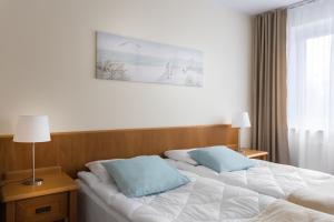 Posteľ alebo postele v izbe v ubytovaní Olymp 114 i 120 z basenem, sauną i jacuzzi w cenie