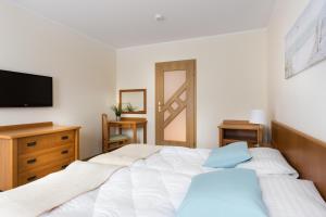 Posteľ alebo postele v izbe v ubytovaní Olymp 114 i 120 z basenem, sauną i jacuzzi w cenie