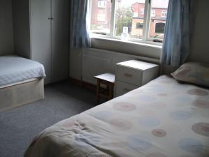 A bed or beds in a room at Maple Lodge 