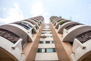 a row of tall buildings with windows on them at Galare Thong Tower in Chiang Mai