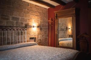 Ένα ή περισσότερα κρεβάτια σε δωμάτιο στο A Corona del Reino