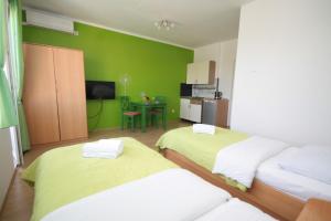 Posteľ alebo postele v izbe v ubytovaní City Center Accommodation