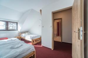 Letto o letti in una camera di Pernštejnův statek