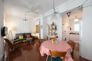 a living room with a table and a couch at Cozy Apartment City Hall in Alicante