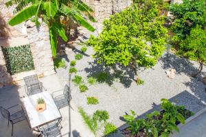 A garden outside Aramis Boutique House
