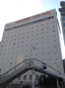 a hotel building with a walkway in front of it at Tokushima Washington Hotel Plaza in Tokushima