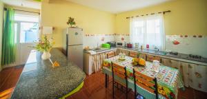 Una cocina o cocineta en Case Latanier