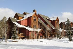 a large log cabin in the snow at Lakeside Village by Keystone Resort in Keystone