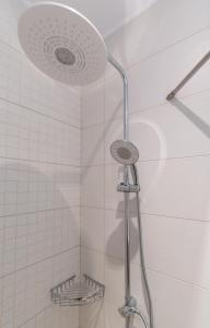 a shower with a shower head in a bathroom at Kamis Suite in Neos Marmaras +37 photos