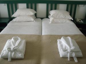 Postel nebo postele na pokoji v ubytování Hotel Escola