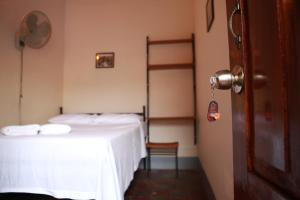 Letto o letti in una camera di Hostal La Tortuga Booluda