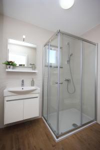 a bathroom with a shower and a sink at Apartments Obitelj Vuletić in Makarska +65 photos