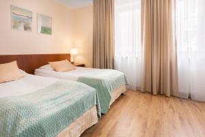 Posteľ alebo postele v izbe v ubytovaní Olymp 114 i 120 z basenem, sauną i jacuzzi w cenie