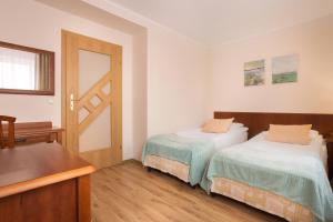 Posteľ alebo postele v izbe v ubytovaní Olymp 114 i 120 z basenem, sauną i jacuzzi w cenie