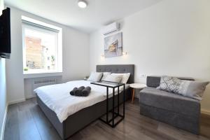 Posteľ alebo postele v izbe v ubytovaní At queens