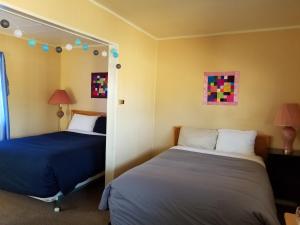 Postel nebo postele na pokoji v ubytování Melsask Motel