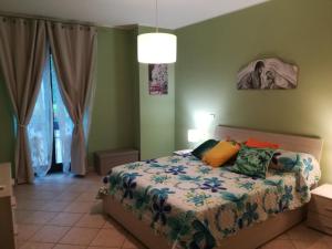 
A bed or beds in a room at "Profumo di Tiglio"
