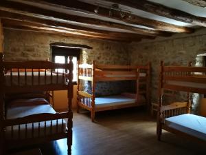 Postel nebo postele na pokoji v ubytování La Bodega Del Camino aka Albergue On TheLe