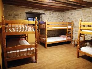 Postel nebo postele na pokoji v ubytování La Bodega Del Camino aka Albergue On TheLe