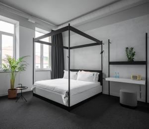 Postel nebo postele na pokoji v ubytování BURSA Hotel Kyiv