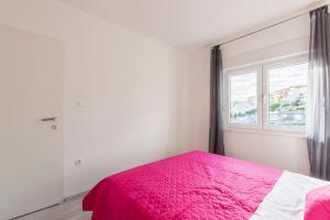 Postel nebo postele na pokoji v ubytování Apartments Karlo