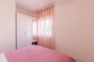Postel nebo postele na pokoji v ubytování Apartments Karlo
