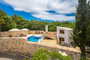 an image of a villa with a swimming pool at Holiday Home Jela in Dobrinj