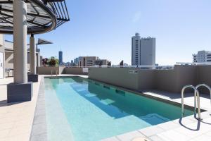 a swimming pool on the roof of a building at Gabba Central Apartments in Brisbane