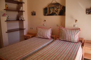 Ліжко або ліжка в номері Apartment Eleni