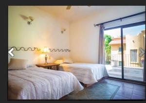 Postel nebo postele na pokoji v ubytování Villa Ikal + 30 fotografií