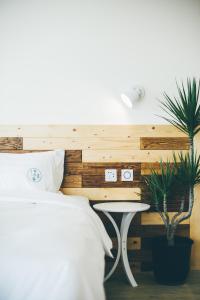 Postel nebo postele na pokoji v ubytování Yellow's Kenting B&B