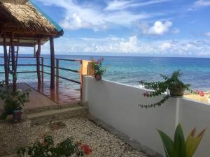 a view of the ocean from the balcony of a resort at Costa Cantagay in Jagna