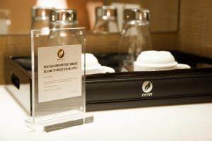 a bottle on a counter with a sign on it at Garden Sentral Hotel in Kuala Belait
