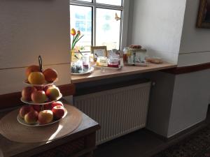 a counter with two plates of fruit on a table at Rheinhotel St. Goar in Sankt Goar +13 photos