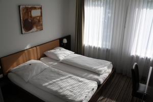 Postel nebo postele na pokoji v ubytování Gasthof Hoppe