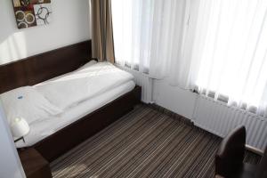 Postel nebo postele na pokoji v ubytování Gasthof Hoppe