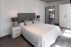 Ag Casa Del Mar Premium tesisinde bir odada yatak veya yataklar