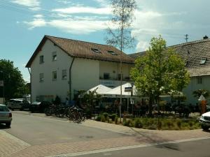 a building with bikes parked in front of a street at Santos in Kappel-Grafenhausen